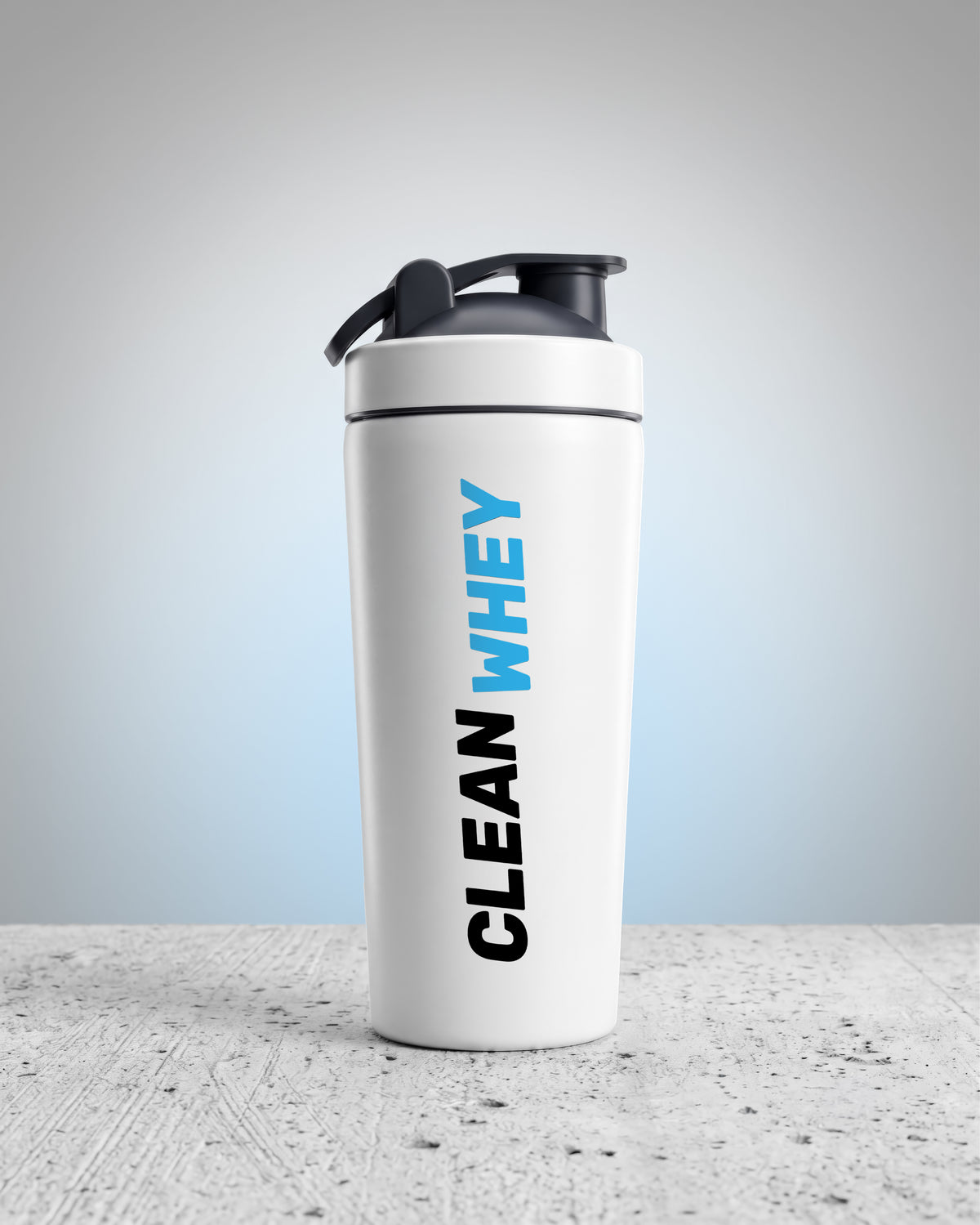 A white shaker bottle with a black lid and a vertical 'CLEAN WHEY' logo printed on the front, set on a textured gray surface against a light gray background.