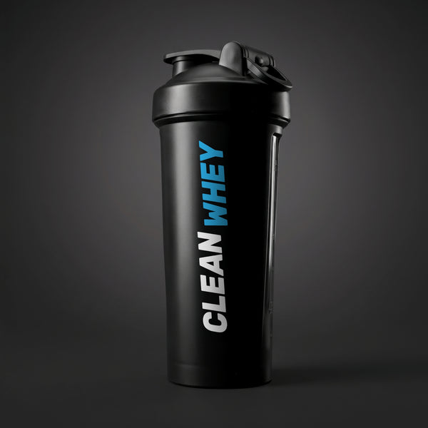 A matte black shaker bottle with a matching black lid, featuring the text 'CLEAN WHEY' printed vertically on the side in white and bright blue. The bottle is set against a dark blue gradient background on a dark, textured surface.